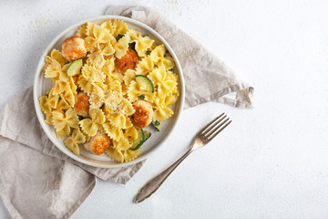 zucchini pasta meatballs on the table top view Italian food farfalle