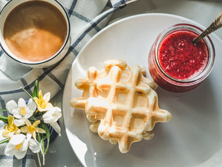 Homemade ice cream and fragrant waffles, lying on the table. Close-up, view from above. Tasty and...