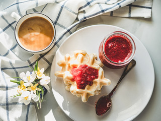 Homemade ice cream and fragrant waffles, lying on the table. Close-up, view from above. Tasty and healthy eating concept