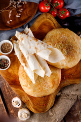 Different types of bread on a wooden Board