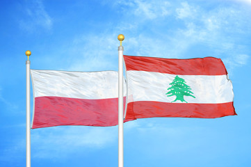 Poland and Lebanon two flags on flagpoles and blue cloudy sky