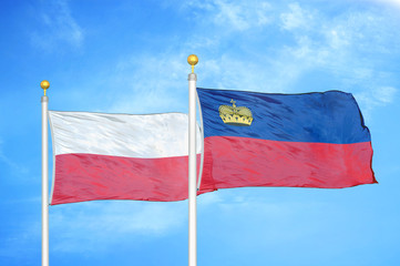 Poland and Liechtenstein two flags on flagpoles and blue cloudy sky