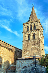 A fragment of the stone belfry of the medieval church of the city of Aubenas in France.