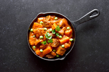 Beef stew with potatoes and carrots in tomato sauce