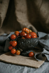 Bowl of Tomatoes on Rustic on a gray background