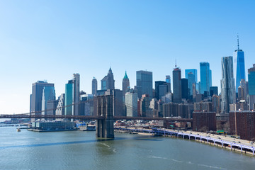 Fototapeta na wymiar The Brooklyn Bridge and the Lower Manhattan New York City Skyline along the East River