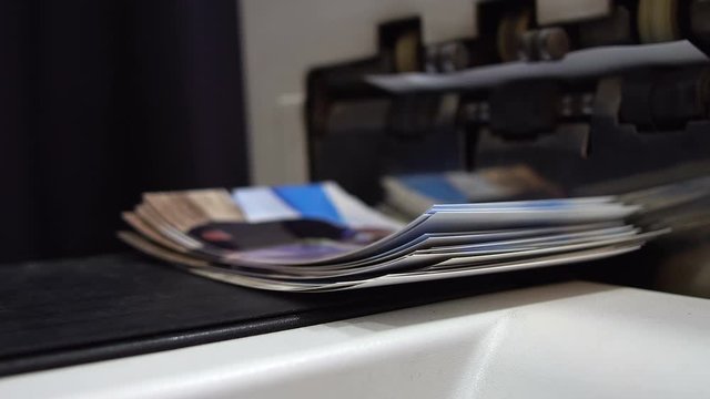 Pile of printed photographs in print shop for photo album