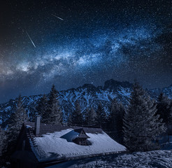 Milky way over old mountain shelter by sea eye lake