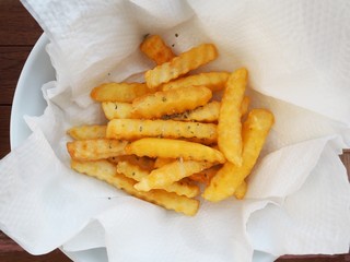 fish and chips french fries serve in tissue paper absorb oil lean