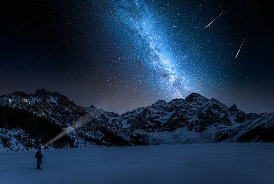 Stunning Morskie Oko mountain lake in winter and milky way