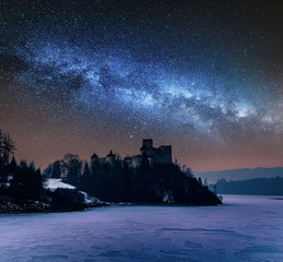Milky way over Niedzica castle in winter, Poland
