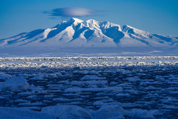 Mountain range with drift ice