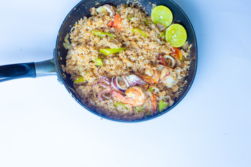 Asian fried rice with tiger prawn shrimp and seafood.