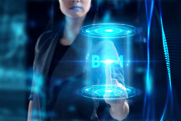 Fototapeta premium Business, Technology, Internet and network concept. Young businessman working on a virtual screen of the future and sees the inscription: BIM