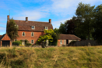 Fototapeta na wymiar Avebury (England), UK - August 05, 2015: A typical house in Avebury village, Wiltshire , England, United Kingdom.