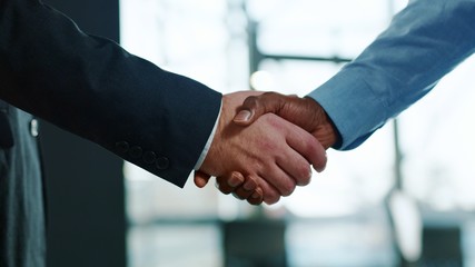 Close up hands business people shaking successful corporate partnership deal welcoming opportunity...