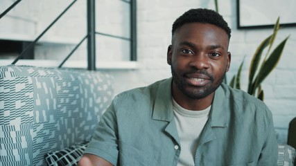 Portrait of attractive young african-american man vlogger speaking looking at camera smile happy recording new vlog blogger broadcast media business webcam businessman distance education