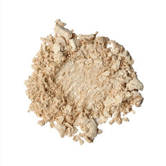 Dry crushed beige eye shadows as sample of cosmetic product isolated on white