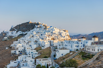 Fototapeta na wymiar The chora - capital with traditional white houses of Serifos island Aegean Cyclades Greece against a blue sky on sunset