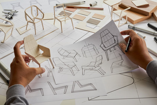Designer sketching drawing design development product plan draft chair armchair Wingback Interior furniture prototype manufacturing production. designer studio concept .