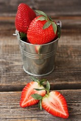 Delicious juicy strawberries on a wooden table