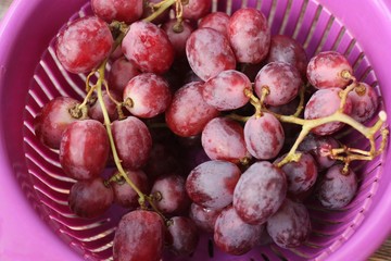 Fresh red grapes on the table macro
