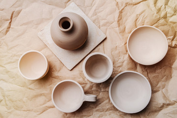 Brown unpainted pots and bowls on craft paper