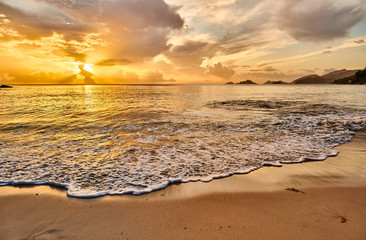 Fototapeta na wymiar Beautiful sunset at Seychelles beach