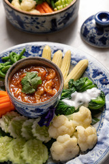 Close up top view of dried shrimp chili dip with variety of vegetable. Traiditional food of Phuket Thailand.