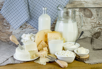 Fresh dairy products on a wooden table.