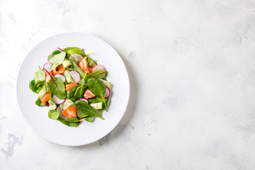 Salmon Salad with Vitamins in vegetables, herbs radish,and spinach