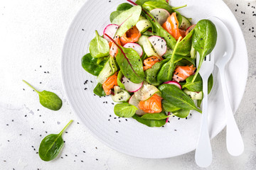 Salmon Salad with Vitamins in vegetables, herbs radish,and spinach