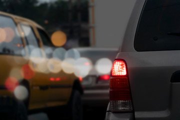 Cars on the road at evening with bokeh light.