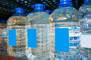 Row of the bottled water on a supermarket