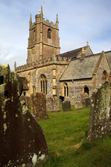 Fototapeta premium Avebury (England), UK - August 05, 2015: The church and cemetery in Avebury village, Wiltshire , England, United Kingdom.