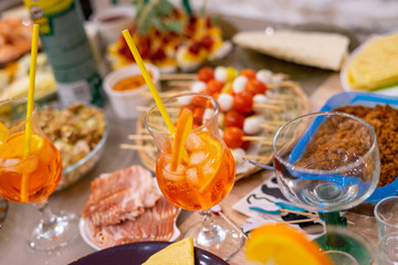Tropical aperol spritz cocktails. view of dinner table
