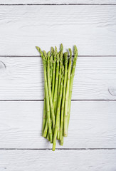 Asparagus on a white wood background