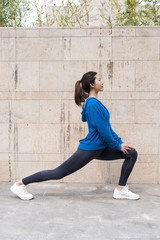 A young Asian woman is doing warm-up exercises