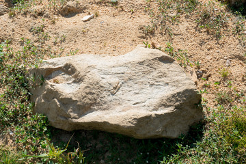 Fototapeta premium Large gravel from the mountains that are outdoors on the ground.