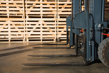 Forklift in a large warehouse for vegetable storage