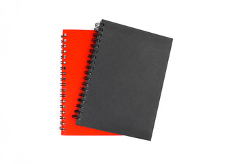 Portrait of two paper note diary of red and black color placed on top of each other