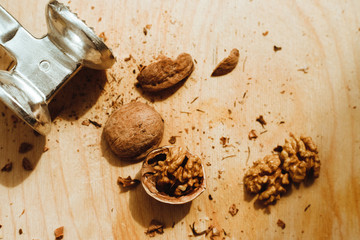 Walnuts, broken shells. Nut kernels on a wooden Board. Close up. Background or texture.