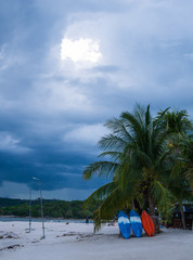 Kayak on the beach with the sea and rain clouds view