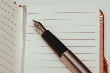 Copper note pad and fountain pen.