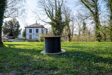 Front view of Fiber optic roll in garden with house in background