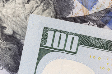 close up of number 100 on one hundred dollars banknote