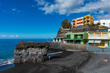 Palms  at beach with black lava sand at Puerto Naos in La Palma Island, Canary Island, Spain. © Curioso.Photography