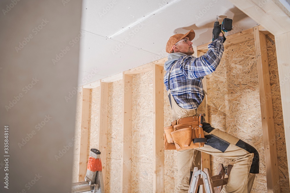 Canvas Prints worker attaching drywall