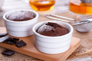 Chocolate muffins in ceramic form