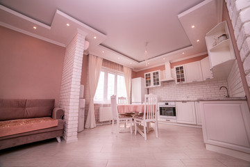 Kitchen interior the room, modern kitchen, a kitchen background, the concept of healthy food, an interior of modern kitchen in beige, brown and white tones with a white brick